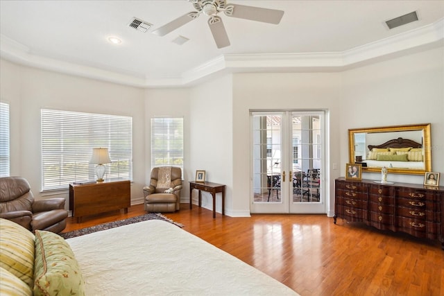 bedroom featuring ceiling fan, access to exterior, hardwood / wood-style flooring, ornamental molding, and french doors