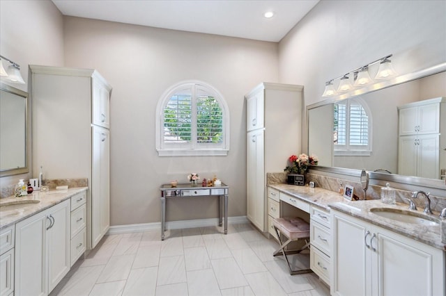 bathroom with vanity and a healthy amount of sunlight