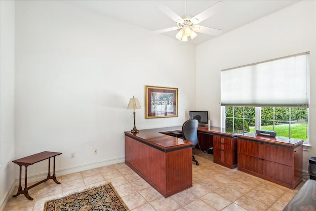 tiled office space featuring ceiling fan