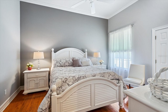 bedroom with dark wood-type flooring, ceiling fan, and ornamental molding