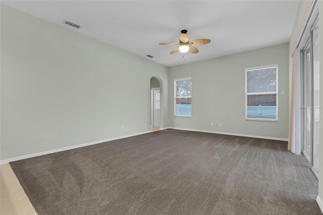 empty room with carpet floors and ceiling fan