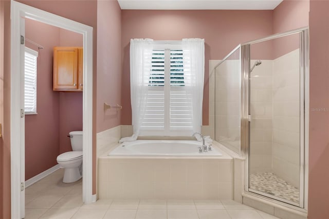 bathroom with tile patterned floors, toilet, and shower with separate bathtub