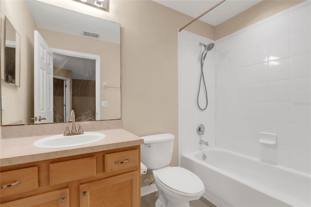 full bathroom featuring vanity, toilet, and tiled shower / bath combo