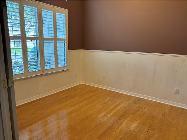 spare room with light wood-type flooring