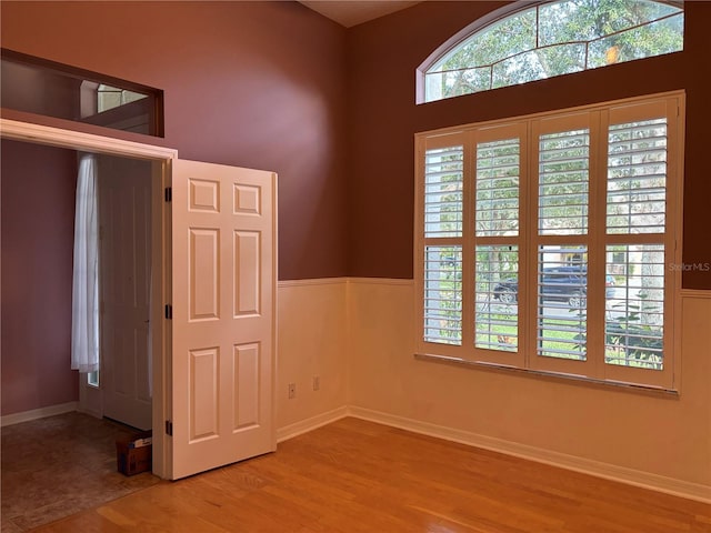 spare room with hardwood / wood-style floors