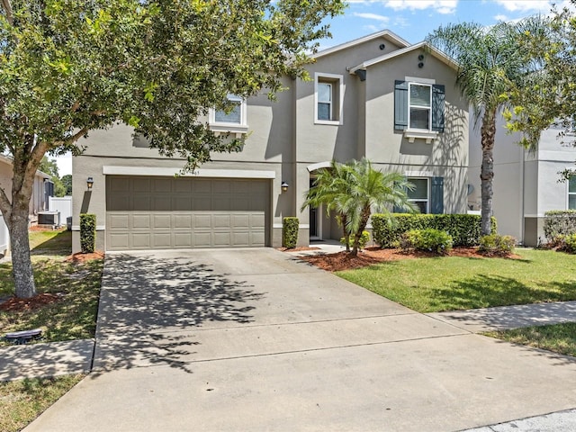 view of front of home featuring a front lawn and a garage