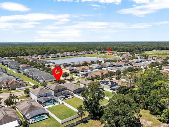 birds eye view of property with a water view