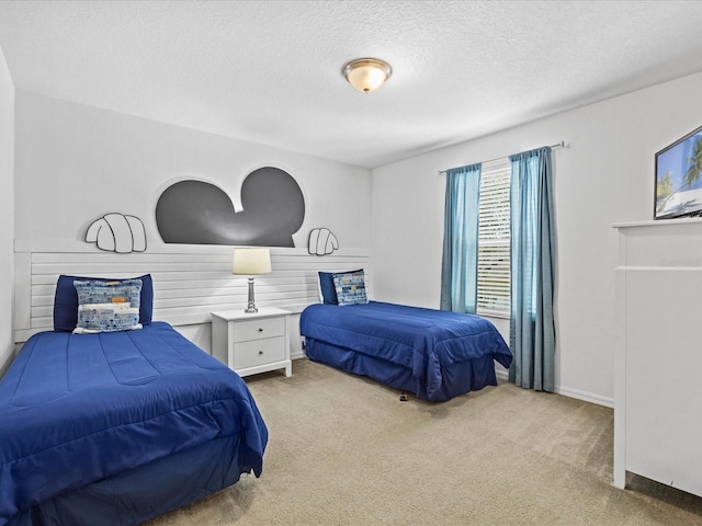 carpeted bedroom featuring a textured ceiling