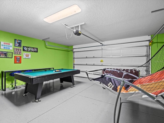 game room featuring a textured ceiling and pool table