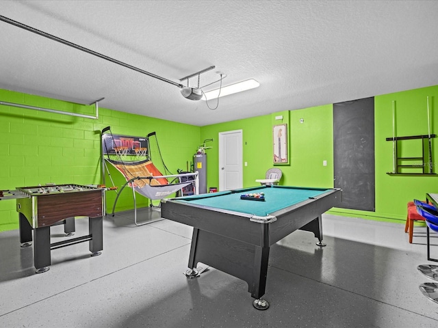 rec room with pool table, a textured ceiling, and gas water heater