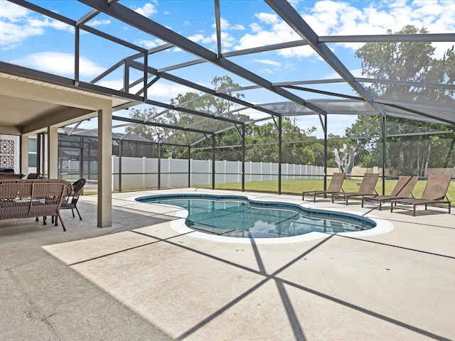 view of pool with a patio and a lanai