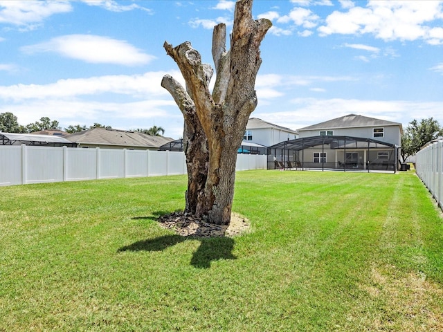 view of yard featuring glass enclosure