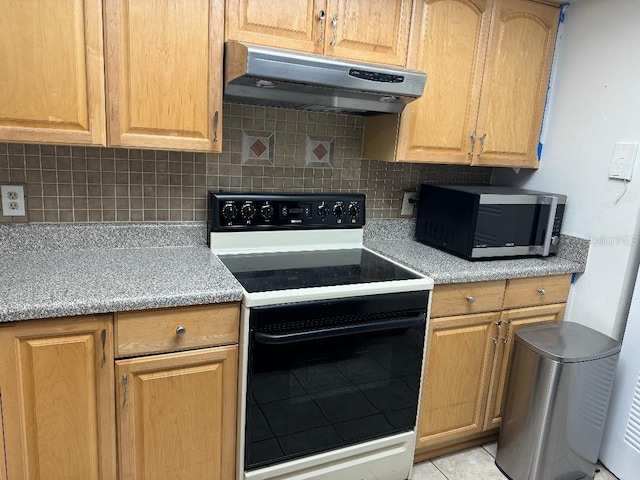 kitchen featuring backsplash, electric stove, and light tile floors