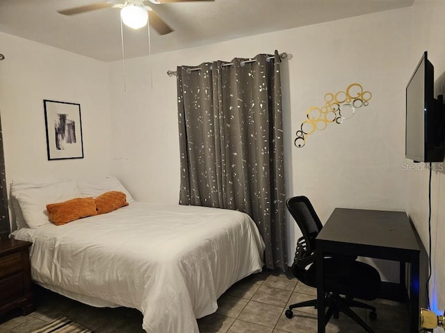 bedroom featuring ceiling fan and tile floors