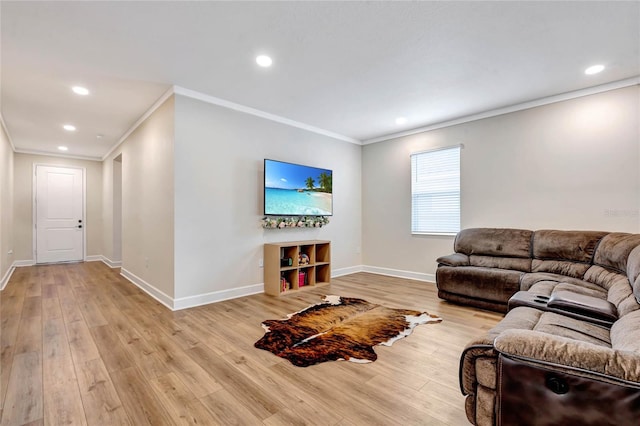 living room featuring light hardwood / wood-style flooring and crown molding