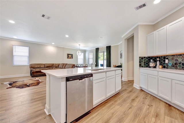 kitchen with white cabinetry, tasteful backsplash, light wood-type flooring, and stainless steel dishwasher