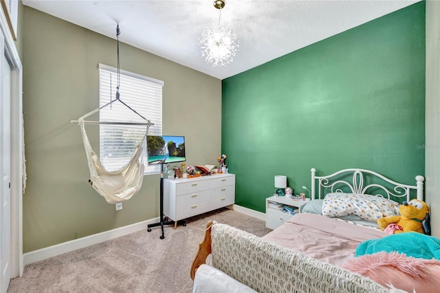 carpeted bedroom with a chandelier