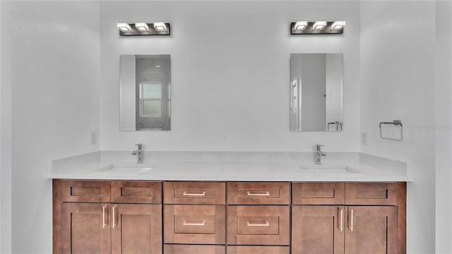 bathroom featuring double vanity