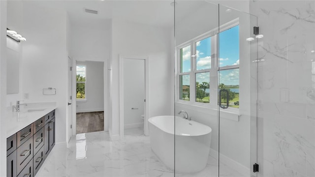 bathroom featuring vanity, tile patterned floors, and a wealth of natural light