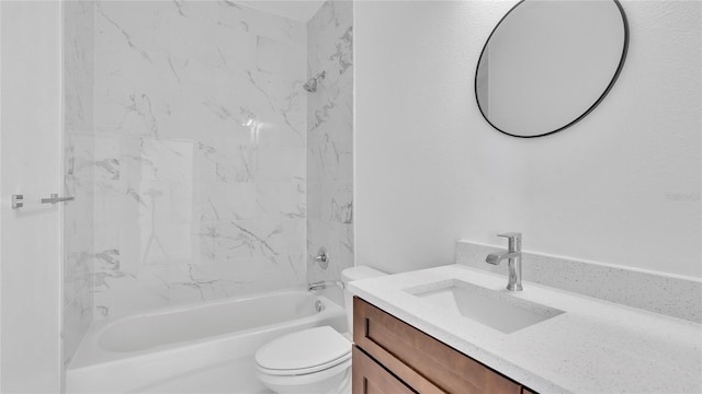 full bathroom with vanity, tiled shower / bath combo, and toilet