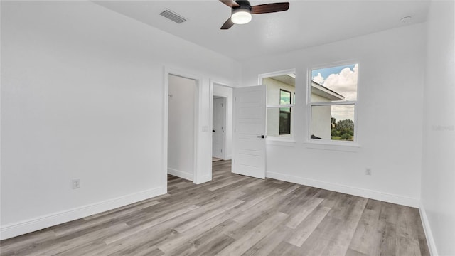 unfurnished room featuring hardwood / wood-style flooring and ceiling fan