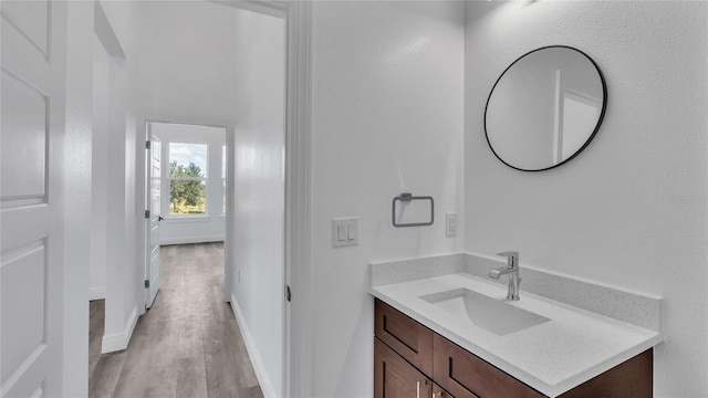 bathroom featuring vanity and hardwood / wood-style floors