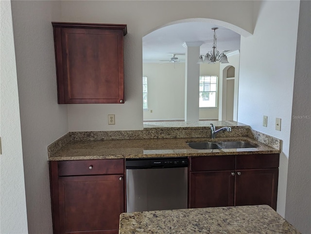 kitchen with dishwasher, ceiling fan with notable chandelier, sink, crown molding, and stone countertops