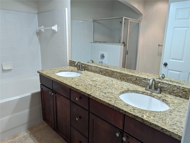 bathroom with plus walk in shower, vanity, and tile patterned floors