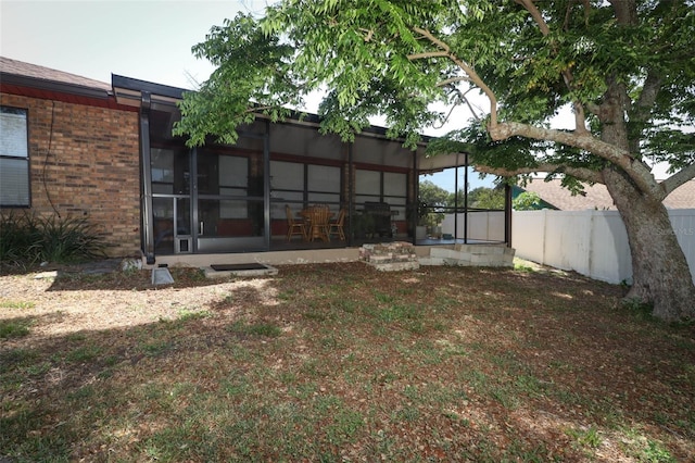 view of yard with a sunroom