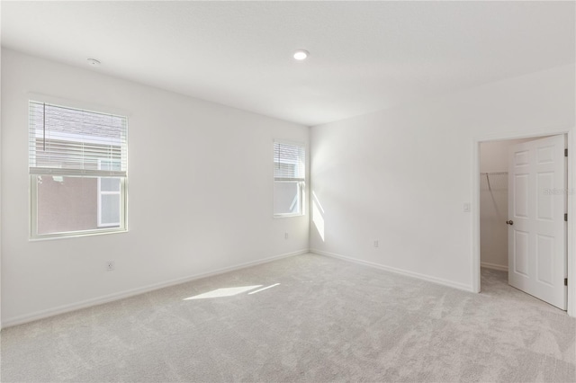 unfurnished room with light carpet