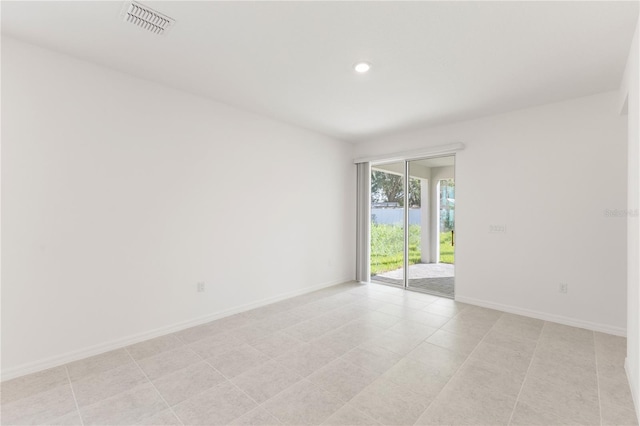 view of tiled spare room