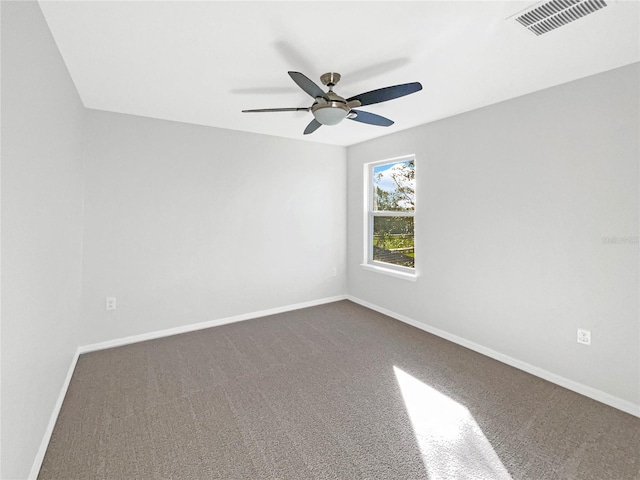 spare room with carpet flooring and ceiling fan