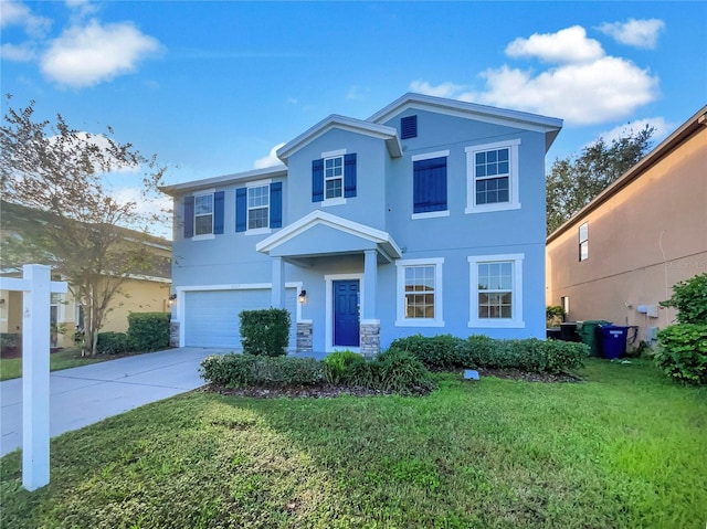 view of front of home with a garage and a front yard