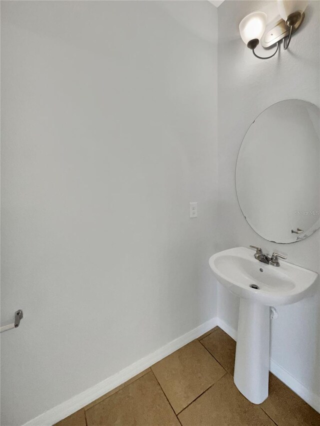 bathroom with tile patterned flooring