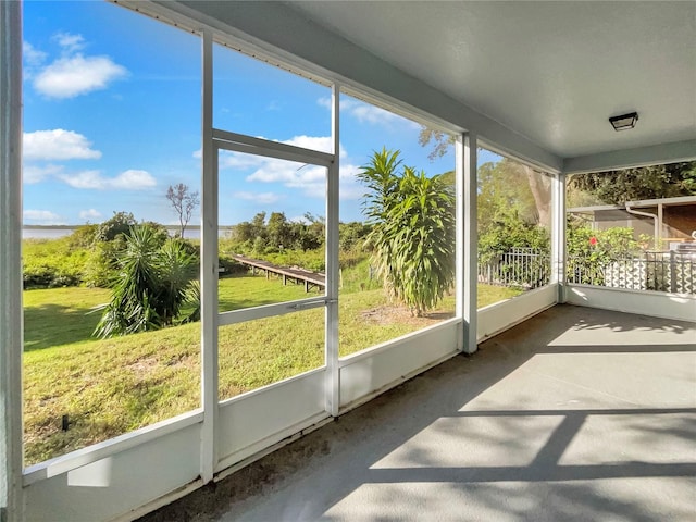 unfurnished sunroom featuring plenty of natural light