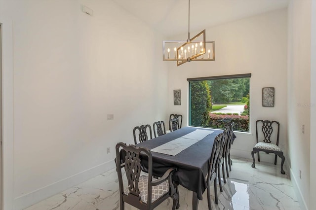 tiled dining room featuring a notable chandelier and lofted ceiling