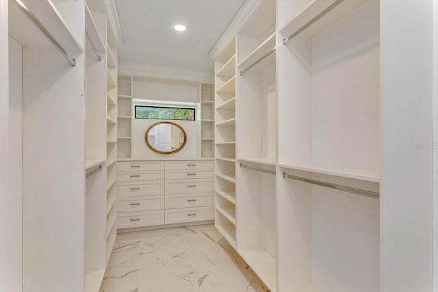 walk in closet featuring light tile floors