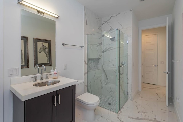 bathroom with tile floors, vanity with extensive cabinet space, an enclosed shower, and toilet