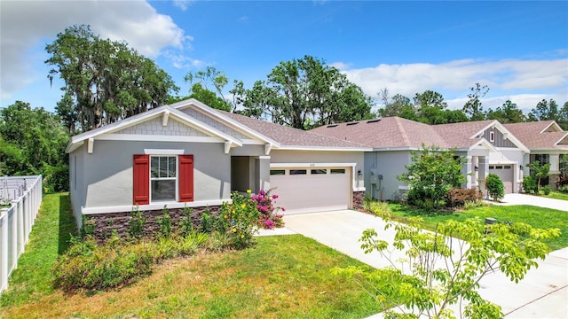 craftsman-style house featuring a garage and a front lawn