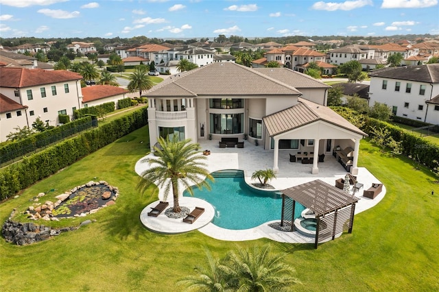 view of swimming pool featuring an outdoor living space, a yard, and a patio