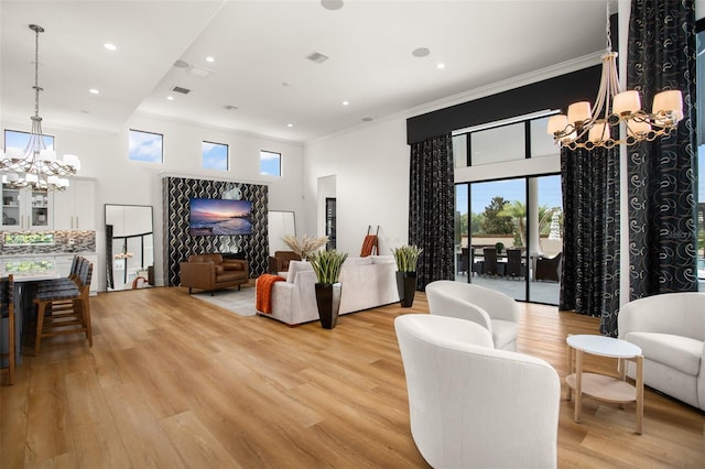 living room featuring light wood-type flooring and ornamental molding