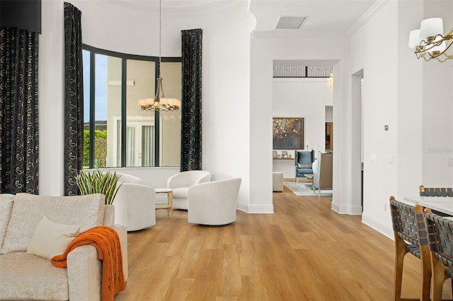 corridor with crown molding and light hardwood / wood-style flooring