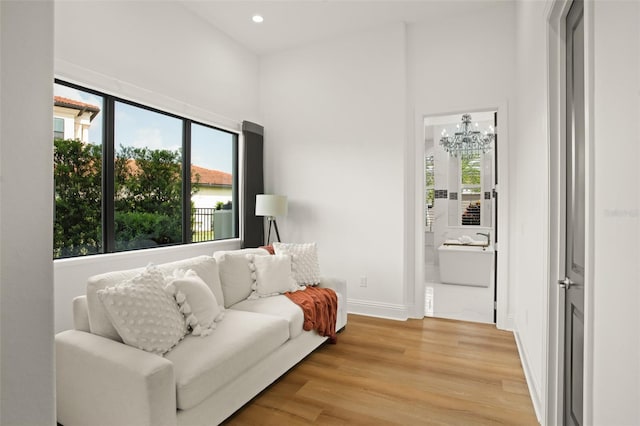 interior space featuring light hardwood / wood-style flooring and an inviting chandelier