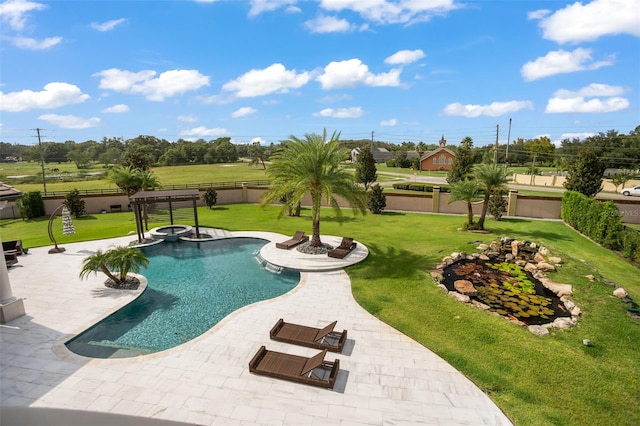 view of pool with a yard and a patio