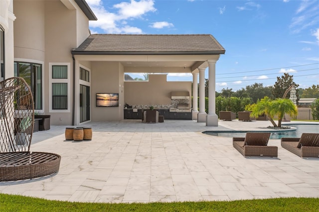 view of patio featuring exterior kitchen