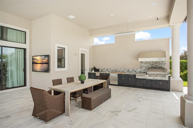 view of patio with a grill and an outdoor kitchen