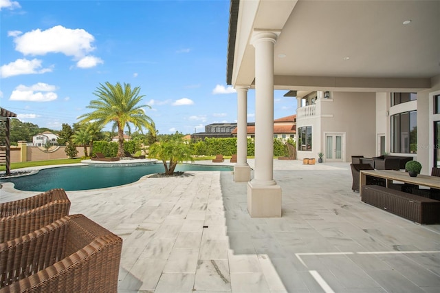 view of pool featuring a patio area and french doors