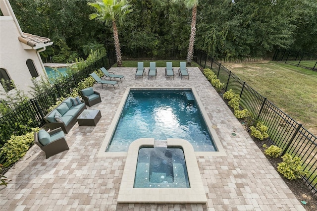 view of swimming pool featuring a patio, an outdoor living space, and a yard