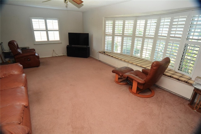 living room with carpet floors and ceiling fan