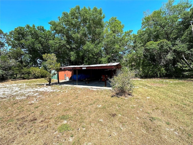 exterior space with a carport